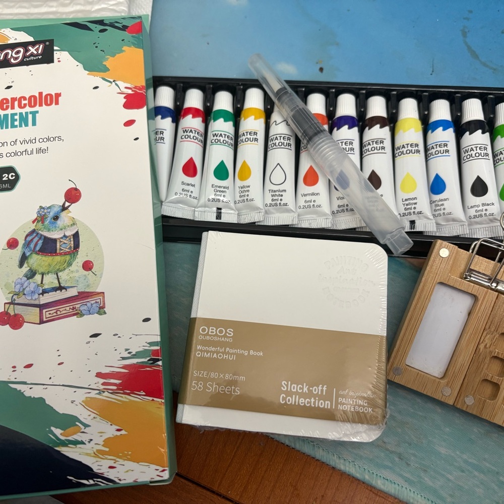 Watercolor Paint Set with Brush and vibrant watercolors.